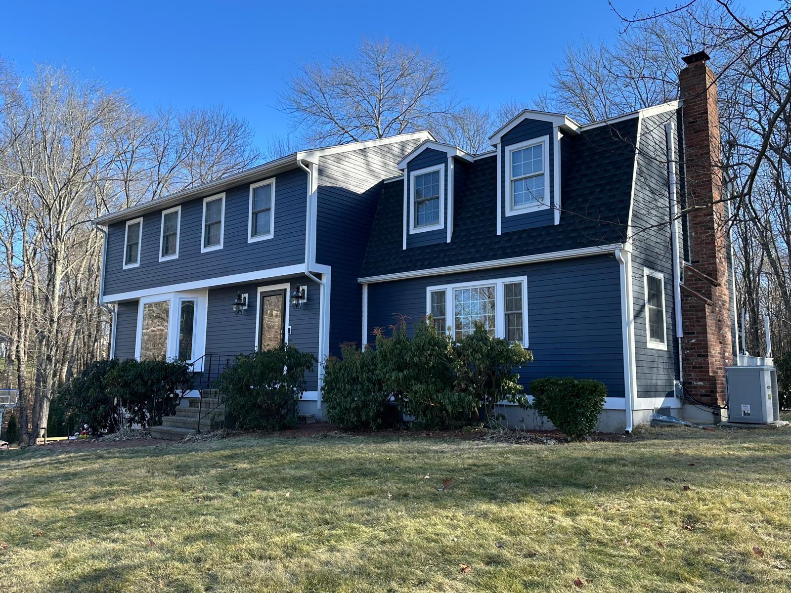 Navy-blue colonial exterior remodel